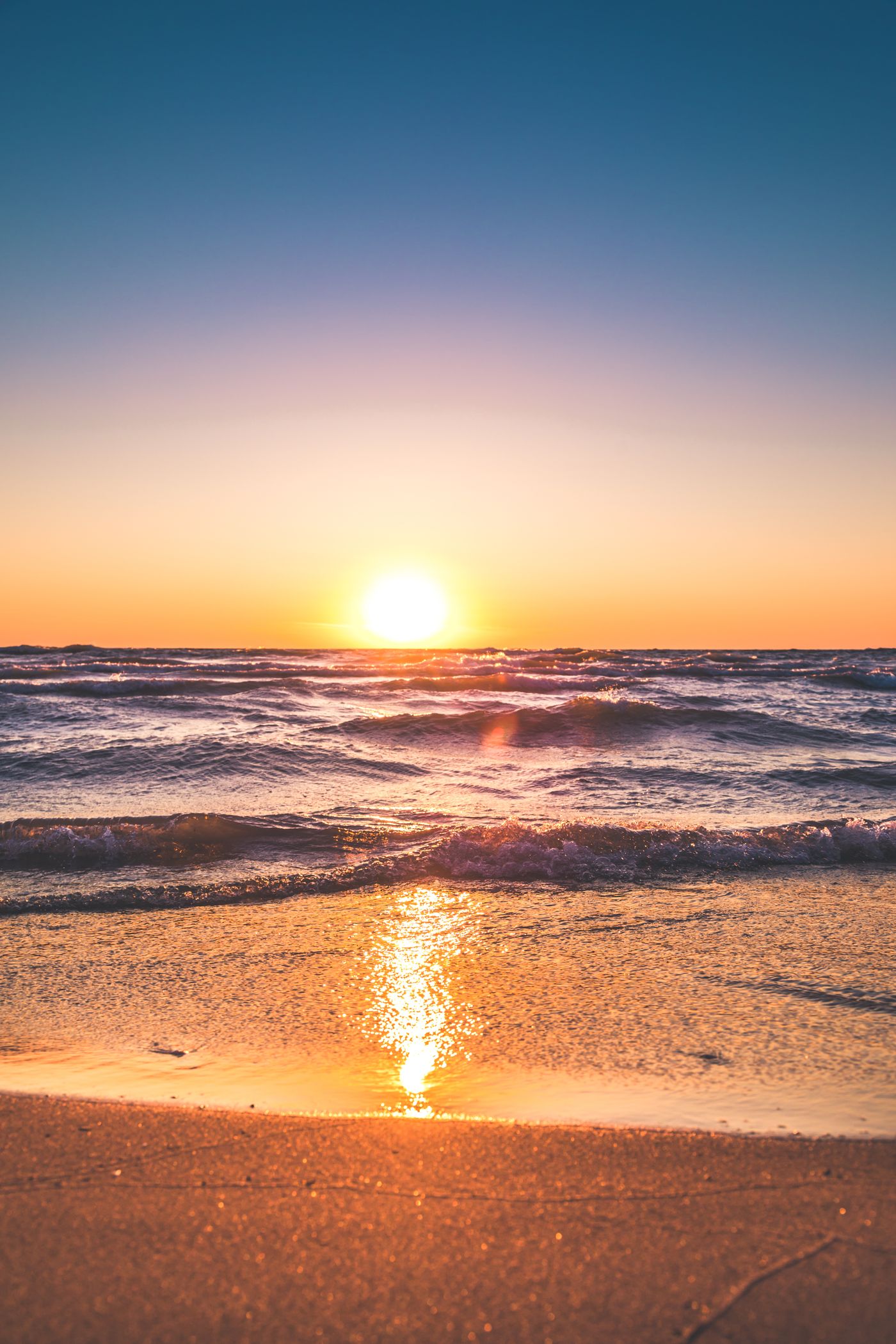 Calm ocean horizon at golden hour, long-term perspective and opportunity